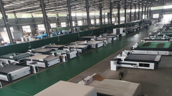 M.RISE CNC digital knife cutting machine factory workshop with multiple industrial cutting systems under production.